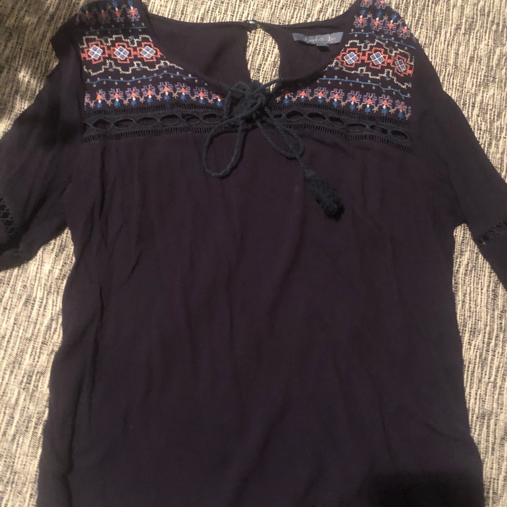 Blouse meant to be layered with.